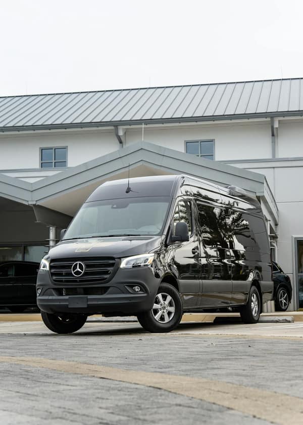 Black Mercedes-Benz passenger Sprinter